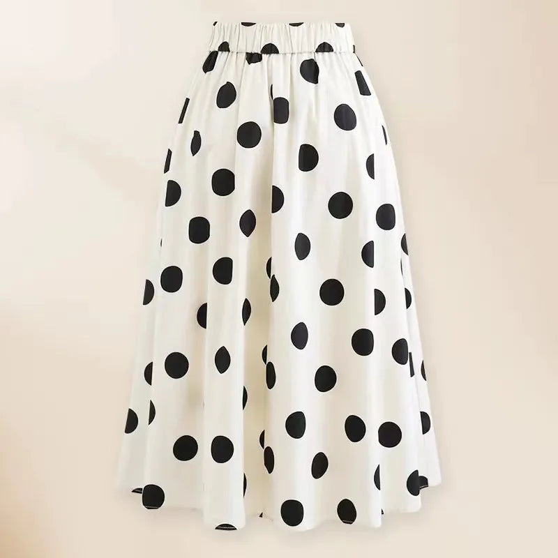 Maillot de bain  1 pièce noir et bain et sa jupe à pois